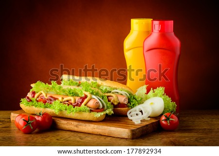 fast food hot dog menu with hotdogs, ketchup, mustard and vegetables