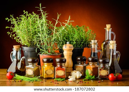 still life with various herbs, spices and olive oil