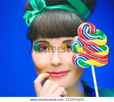 Young charming plump woman with sweets
