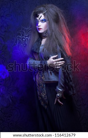 Pirate. One-eyed young woman with artistic visage posing in smoke