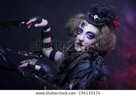 Dark Doll. Young woman in holiday image of mystery gothic doll.