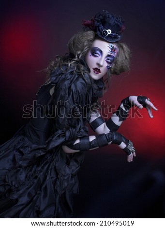 Halloween Doll. Young woman in holiday image of mystery gothic doll.