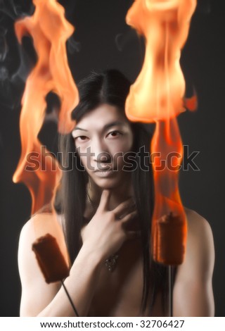 Portrait of asian man with fire