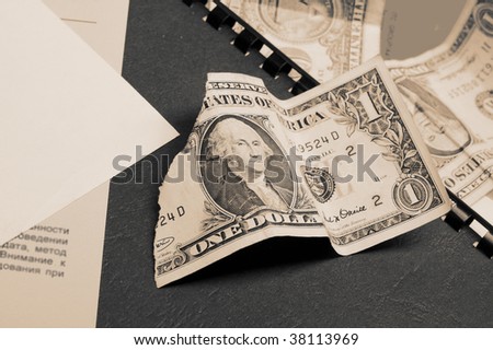 Business background. Old shabby dollars and folders.