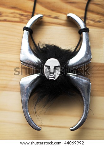 Silver necklace on the wood background