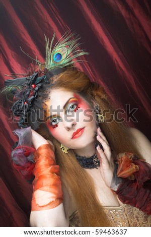 Diva. Portrait of young woman in exotic creative image.