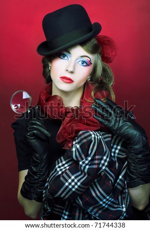 Detective. Young stylish lady in black hat and with loop.