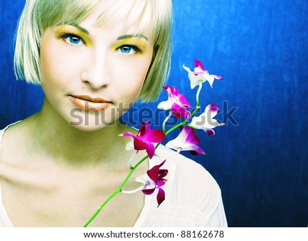 Young pretty lady with pink flower