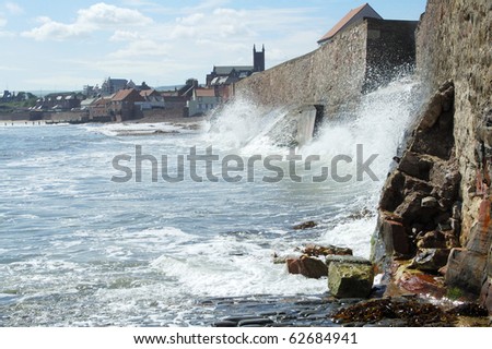 sea and waves crashing against sea wall