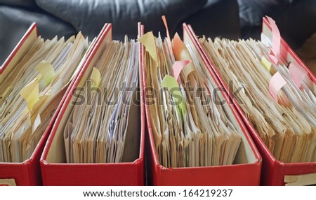 red file folders, a bit messy, close up, selective focus