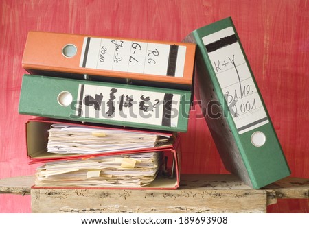 messy file folders, fictional labeling, bureaucracy concept