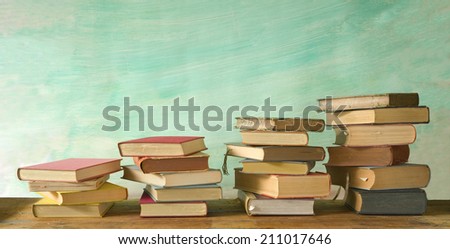 stacks of books, grungy background, free copy space