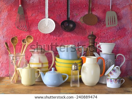 collection of vintage kitchenware, red background