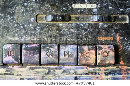 Grungy keyboard of a ghetto blaster, paint splatters