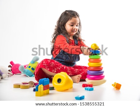 Similar – Image, Stock Photo Small girls building toy construction machine