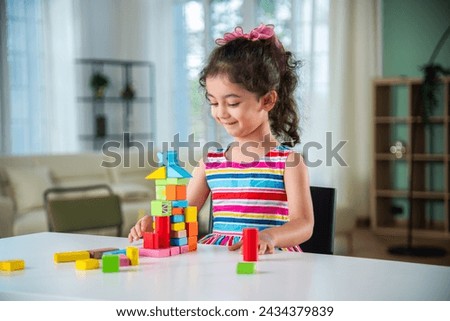 Similar – Image, Stock Photo Small girls building toy construction machine