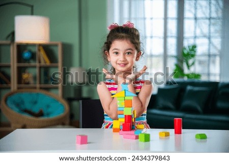 Similar – Image, Stock Photo Small girls building toy construction machine