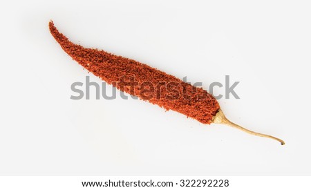 Red chilly created using red chilli powder, closeup on white background, isolated, horizontal view, indian spices