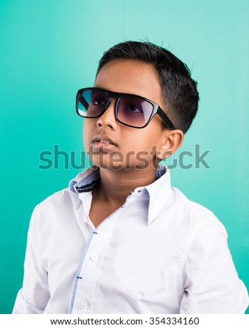 Indian Kid Wearing Dark Glasses Or Goggles, Isolated On Green, 10 Year ...