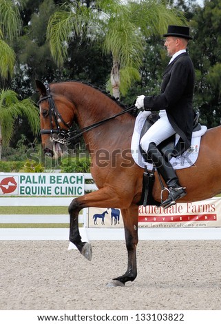 LOXAHATCHEE, FLORIDA - MARCH 23: Olympian Lars Peterson & Mariett compete to  win a blue ribbon at the IHS Champions Cup in the Grand Prix Freestyle test March 23, 2013 in Loxahatchee, Florida.