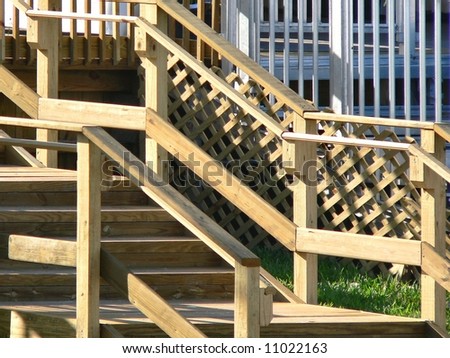 wooden stadium stairway makes abstract photo of intersecting lines and angles