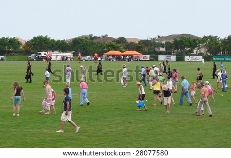 WELLINGTON, FLORIDA - APRIL 5: Halftime tradition of the divot stomp with champagne and ice cream at the 105th US Open Polo Championship in Wellington April 5, 2009 in West Palm Beach, Florida.