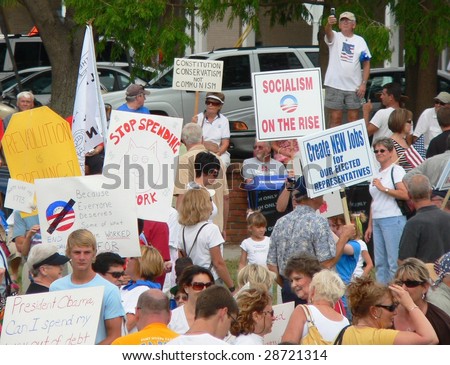 FORT MYERS, FL - APRIL 15: Tax Day Tea Party event participants show their signs in Ft. Myers on April 15, 2009 in Fort Myers.