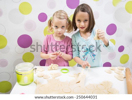 sisters make cake, in kitchen