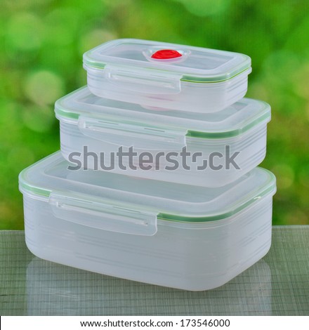 Plastic food containers on a natural background