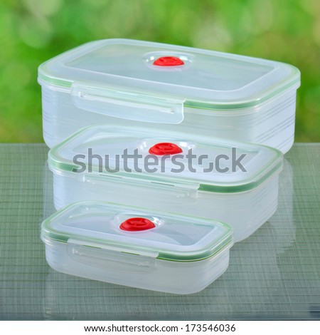 Plastic food containers on a natural background