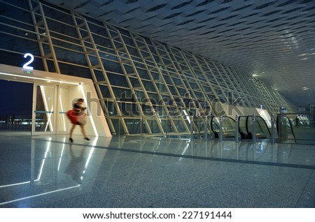 Single woman walking in the airport lobby