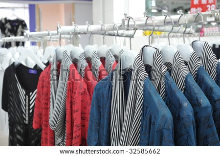 On clothing store clothes rack clothes