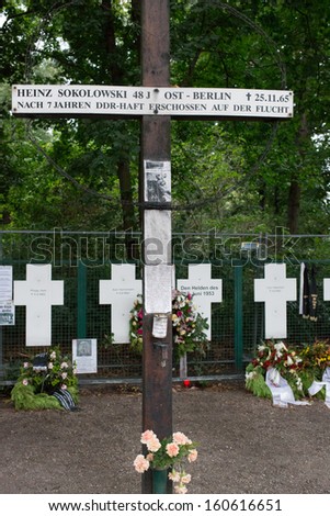 BERLIN. GERMANY - AUGUST 19: Grave crosses near the brandenburger tor Berlin, for victim people try to escape east berlin during cold war 19, 2013. Berlin, Germany.