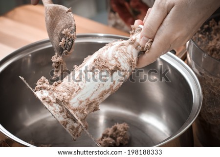 In Polish cuisine, on the Polish table. Preparation of Liver pate. On the picture mixing pig liver pate.