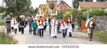 GDANSK KOWALE, POLAND - JUNE 07, 2012: Religious procession at Corpus Christi Day in one of the suburban districts of Gdansk. June 07, 2012. Gdansk, Kowale, Poland.