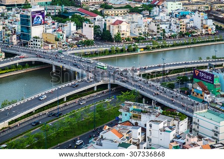 HO CHI MINH, VIETNAM - JUNE 18, 2015: Saigon riverside view at Ong Lanh (Vietnam language) bridge, downtown center with buildings across riverside Saigon river Ho Chi Minh City.