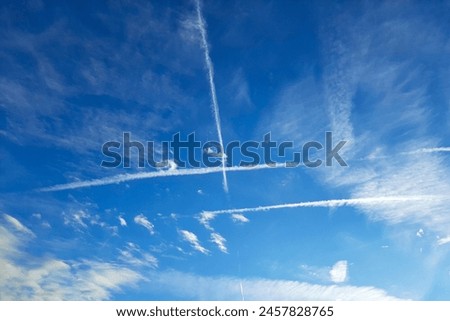 Similar – Image, Stock Photo Crossing contrails in the sky