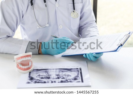 Similar – Image, Stock Photo Dentist working with denture in laboratory