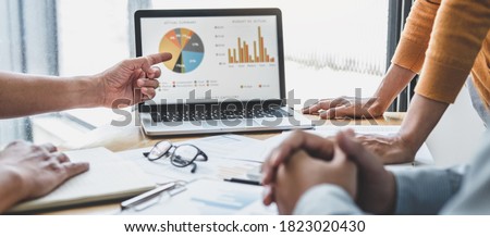 Business team collaboration discussing working analyzing with financial data and marketing growth report graph in team, presentation and brainstorming to strategy planning making profit of company.
