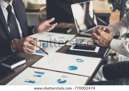 Co working conference, Business team meeting present, investor colleagues discussing new plan financial graph data on office table with laptop and digital tablet, Finance, accounting, investment. Stockfoto © 