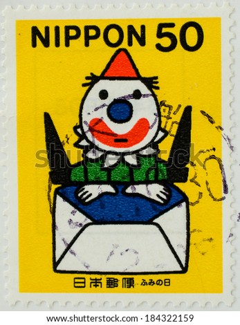 JAPAN - CIRCA 1999: A stamp printed by Japan, shows Clown with yellow hat, jumping up out of envelope, circa 1999