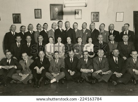 USA- CIRCA 1950s: Vintage photo shows group portrait offfice staff.