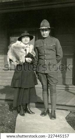CANADA - CIRCA 1930s: Vintage photo shows Portrait of an officer and his wife.