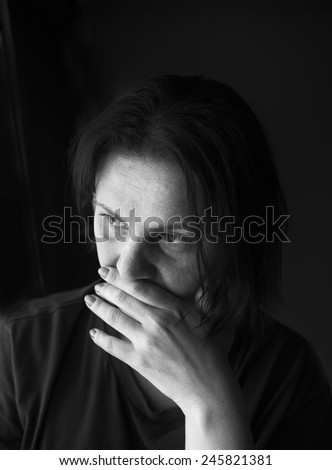 Black and white portrait of a sad woman
