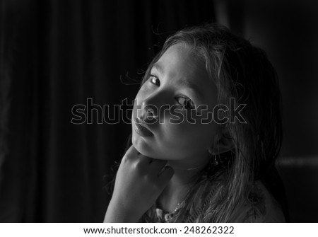 Black and white portrait of a pensive girl