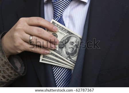 Woman gets money from the businessman\'s pocket