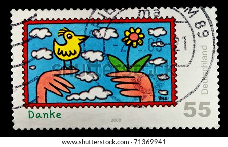 GERMANY - CIRCA 1988: A stamp printed in Germany showing children\'s drawing birds and flowers and the words \