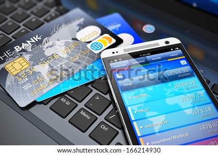Mobile banking, financial success, accounting and electronic internet money payments business concept: macro view of stack of credit cards and modern touchscreen smartphone on office laptop keyboard