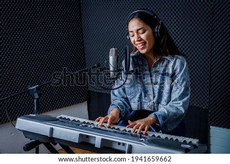 Similar – Image, Stock Photo Smiling woman playing piano in living room