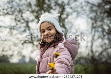 Image, Stock Photo Child holding dandelion